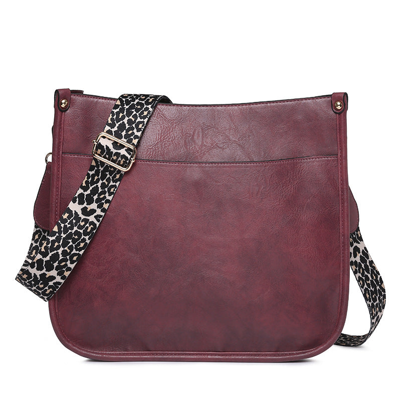 Unik Classic Leather Crossbody Bag with Leopard print shoulder strap